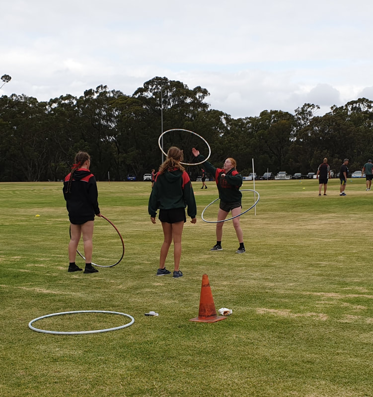 Teenagers learning double hoops